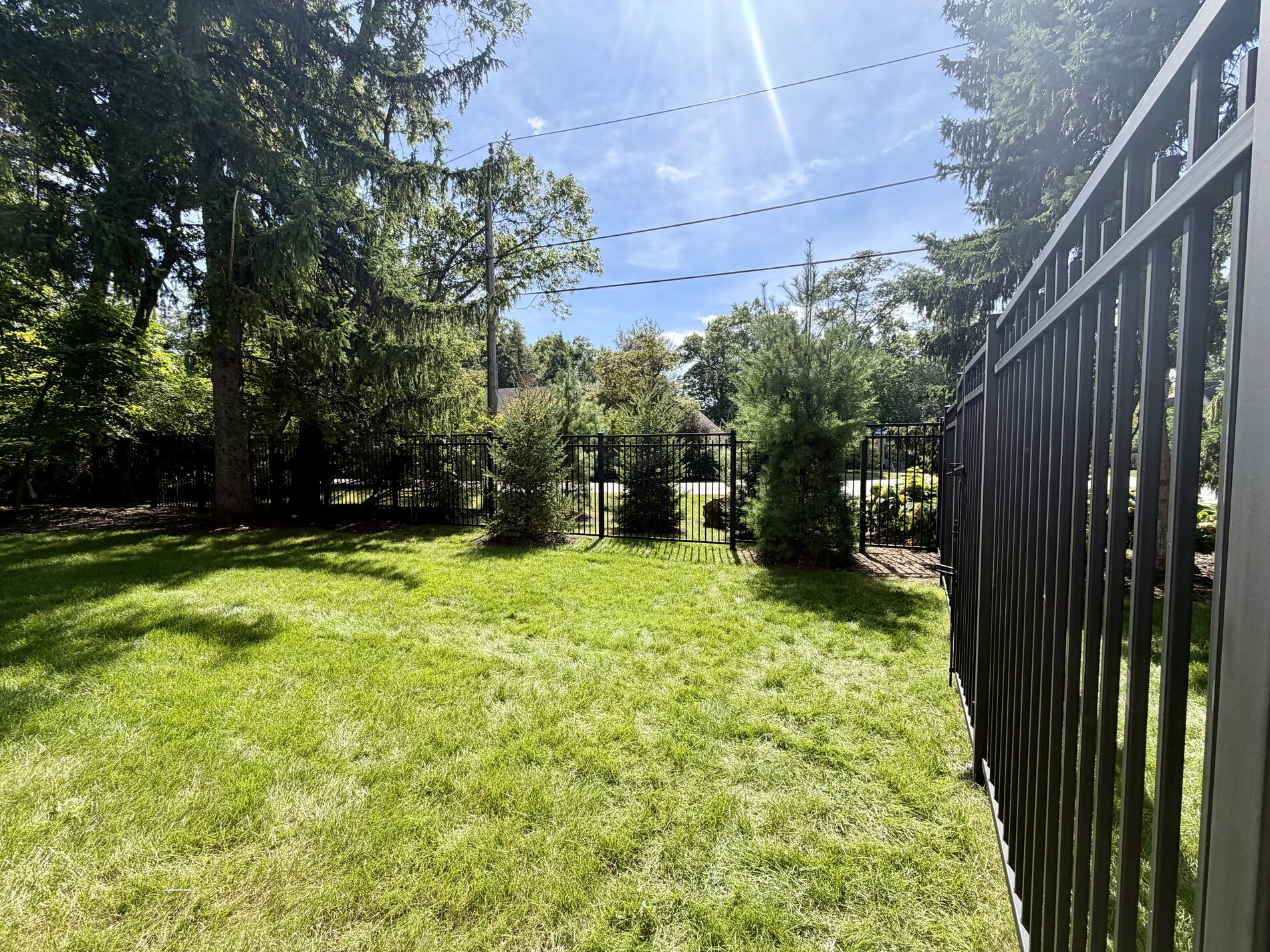 1654 Birchwood Drive — completed metal-fenced privacy yard